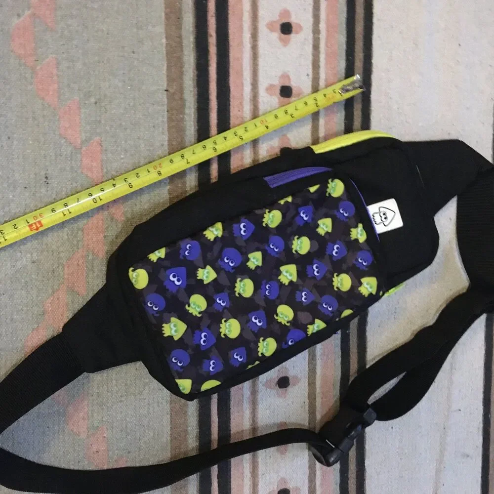 Nintendo Switch carrying case crossbody sling back blue green squids on black